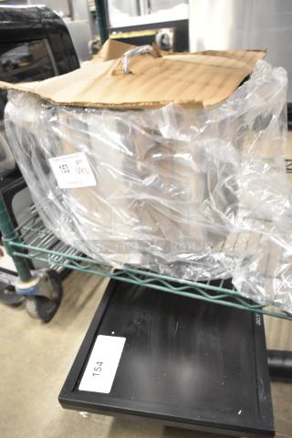 Brand new white mixing bowl and stainless steel stock pot in packaging. Minor scratches. Stock pot has a lid. Visible label: "153 QTY VNL."