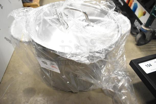 Brand new 2-piece set with a white mixing bowl and stainless steel stock pot. Clear protective wrapping with visible auction label.