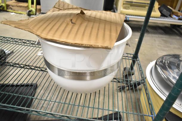 White mixing bowl with silver band, scratch and dent condition, new. Cardboard cover partially visible.