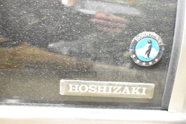 2022 Hoshizaki HNC-120BA-R-SLH stainless steel sushi display case, right compressor, glass damage noted.