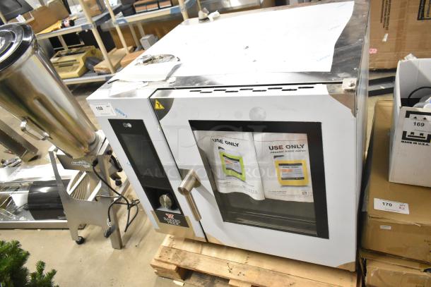 Brand new Bakers Pride AEHE061R stainless steel combi convection oven, 208V, 3-phase, slight scratches and dents visible.