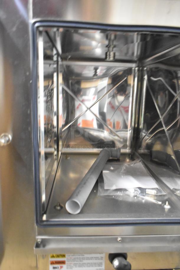 Bakers Pride AEHE061R stainless steel commercial combi convection oven, new with minor scratches. 208V, 3-phase.