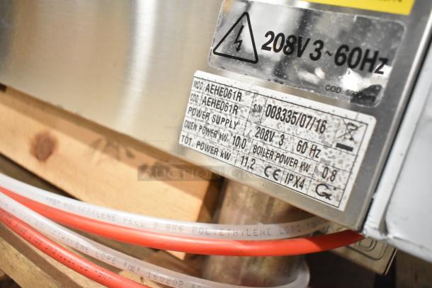 Stainless steel Bakers Pride AEHE061R combi convection oven. 208V, 3 phase. Scratch & dent condition. Power details on label.