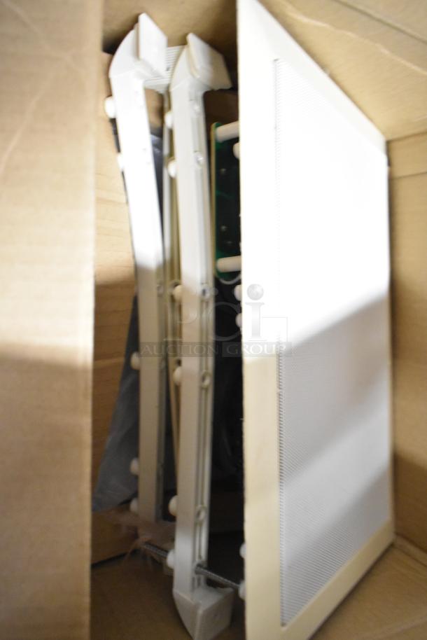 Box containing Control 126WT in-wall loudspeaker, white frame, undamaged, with mounting brackets visible.