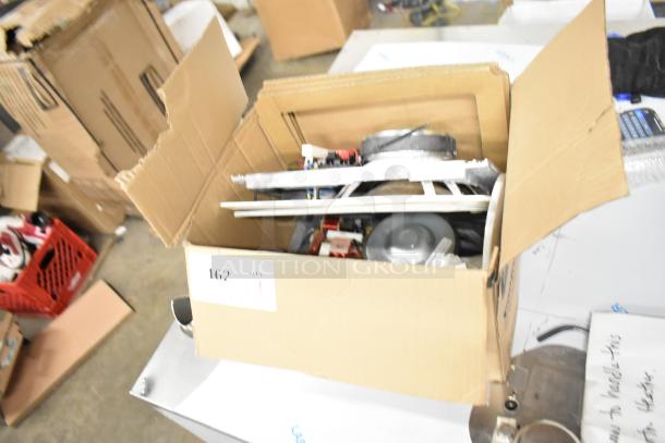 Box of Control 126WT In-Wall Loudspeaker parts, partially assembled. Condition appears used, includes various components.