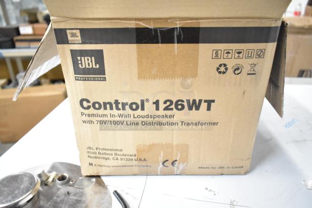 Box of JBL Control 126WT In-Wall Loudspeaker with 70V/100V line transformer, unopened, features professional audio quality.