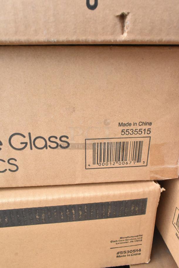 Cardboard boxes containing 27 scratch and dent items, mainly glasses and plastic tumblers. Boxes marked "Made in China."