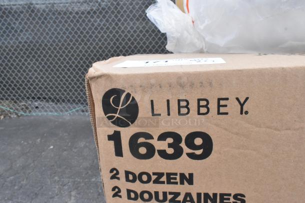 Cardboard box labeled "Libbey 1639," contains two dozen glassware items, part of a scratch and dent sale.