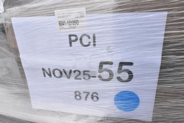 Plastic-wrapped pallet with "PCI NOV25-55 876" sign. Contains 38 brand new scratch and dent items: paper towels, trash bags, gloves, containers.