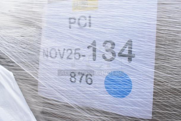 Pallet of 30 new scratch and dent items wrapped in plastic, labeled "NOV25-134, 876", including cups and containers.
