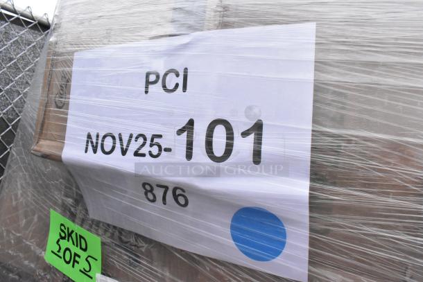 Skid containing 25 new scratch and dent items wrapped in plastic; labels show "PCI NOV25-101 876" and "SKID 2 OF 5".