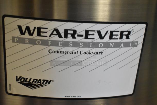 Three brand new Vollrath stainless steel stock pots, Wear-Ever Professional label visible, made in the USA, commercial cookware.