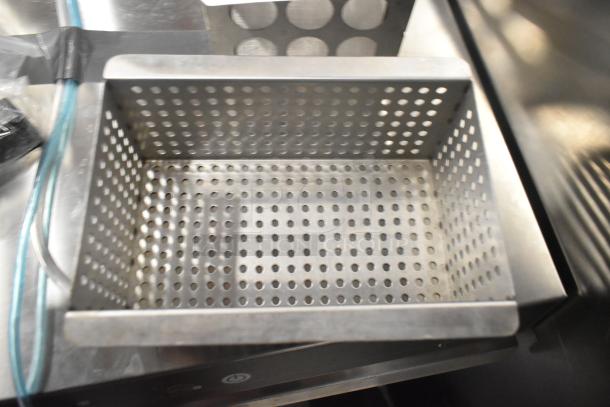 Perforated metal basket, brand new, showcasing a durable stainless steel construction. Part of a set with coil and thermostatic control.