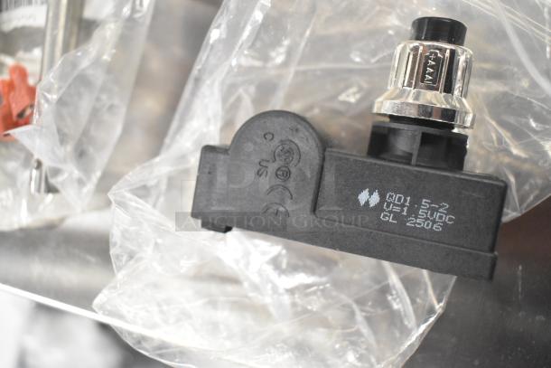 5 brand new items including coil, thermostatic control, and basket; features markings indicating model and specifications.