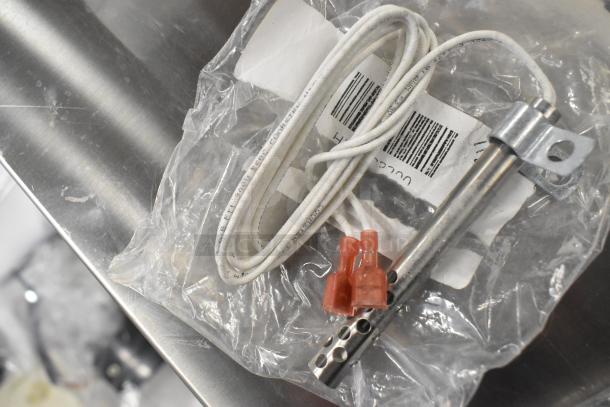 Brand new thermostatic control with coil and wiring in packaging, includes barcode.