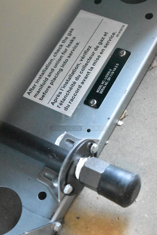 Brand new Vulcan LG300-2 propane fryer, 90,000 BTU, stainless steel, metal baskets, with label on checking gas manifold.