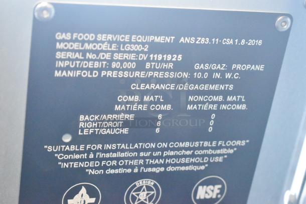 Alt text: Vulcan LG300-2 fryer label, 90,000 BTU, propane gas, model LG300-2, serial DV1191925, for commercial use.