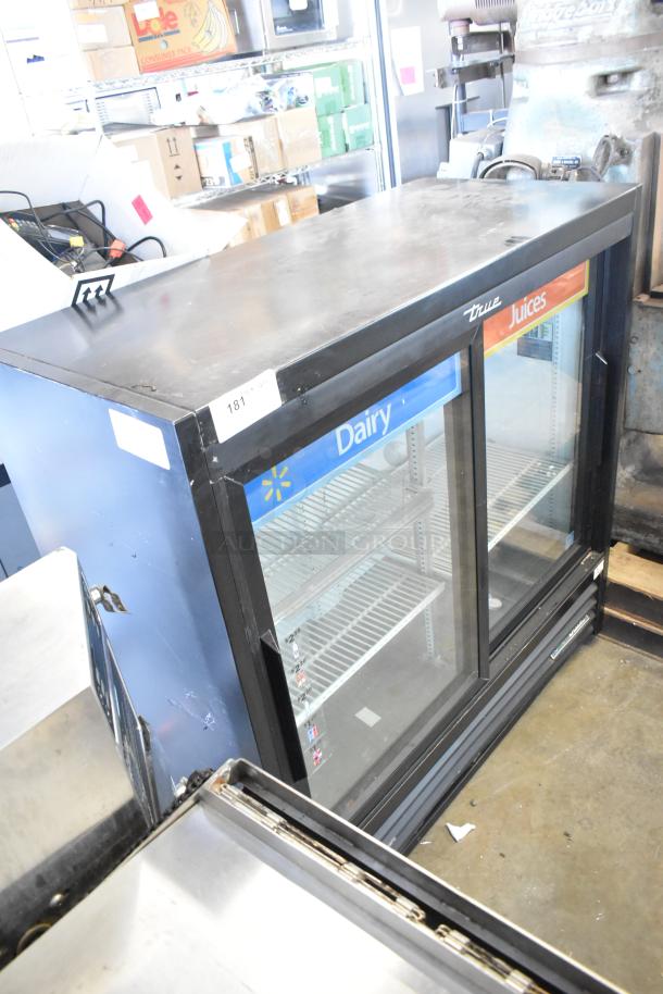 2019 True TBB-24-60G-HC-LD cooler merchandiser, 2 glass doors, black metal, poly coated racks, 115V, labeled for dairy and juices.