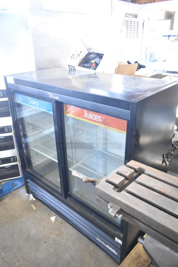 2019 True TBB-24-60G-HC-LD 2-door metal cooler, poly-coated racks, glass fronts, 115V, display signs for dairy and juices.