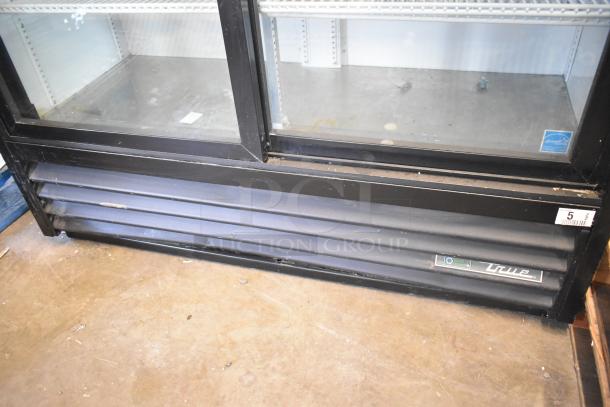 True TBB-24-60G-HC-LD cooler, 2-door, poly coated racks, visible brand label, minor wear, 115V, 1 phase.