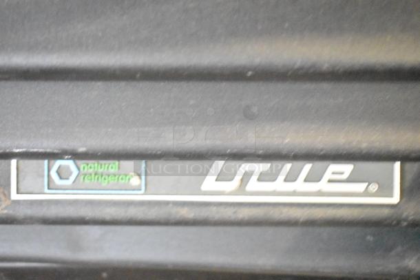 2019 True TBB-24-60G-HC-LD commercial cooler label. Brand logo and "natural refrigerant" text visible.