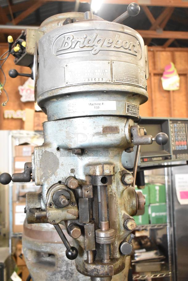 Bridgeport metal milling machine with Turnvision monitor, in used condition. Machine #159, serial #J50089 visible.