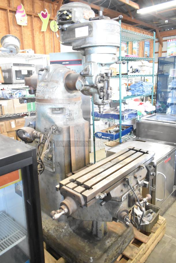 Bridgeport Metal Commercial Milling Machine with Turnvision Monitor, floor style, visible wear, solid construction.