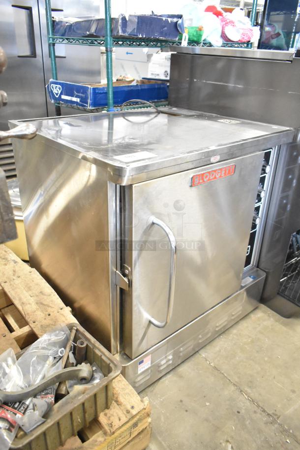 Blodgett stainless steel commercial half-size convection oven, gas-powered, with solid door, metal racks, and thermostatic controls.