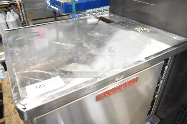 Blodgett stainless steel commercial gas convection oven with solid door, metal racks, and thermostatic controls. Slight wear visible.