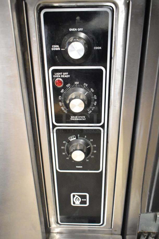 Blodgett stainless steel gas convection oven controls, features solid door, metal racks, and thermostatic controls.