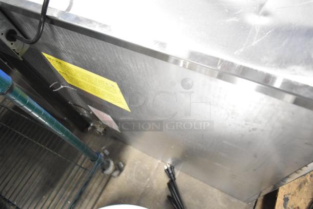 Blodgett stainless steel commercial gas convection oven, half size, solid door, metal racks, thermostatic controls, tags visible.