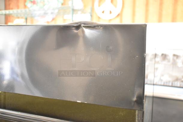 Hussmann MDN3575B1A black metal commercial open air merchandiser, 35", with visible top dents, 120/250V, 1 phase.