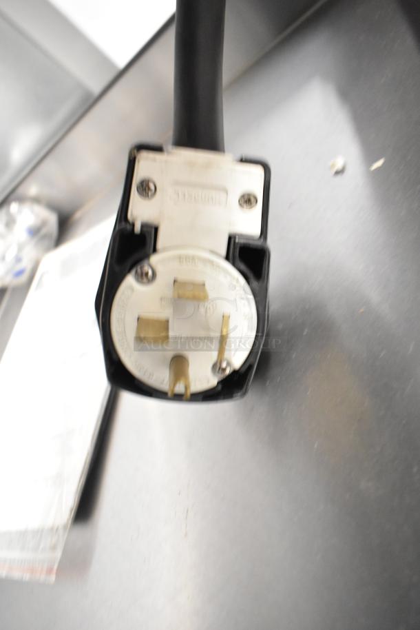 Turbochef HhC2020 electric conveyor oven plug, 208/240V, 3-phase, stainless steel. Plug detail on metal surface.