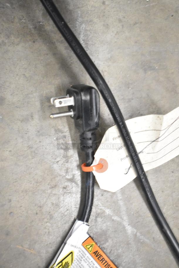 Power cord for 2019 Habco SE18 cooler with visible warning tags and identification label on floor.