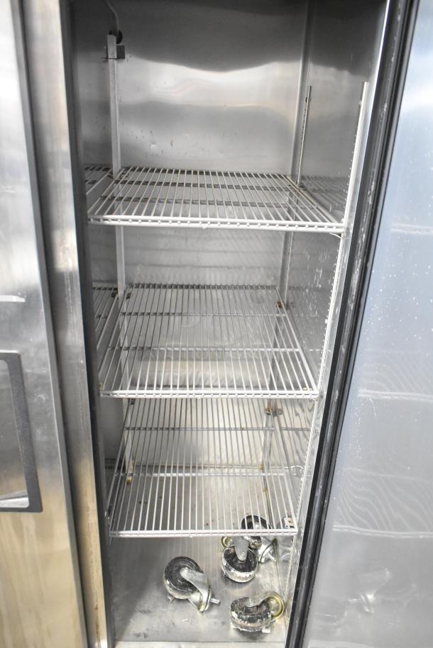 True T-35 stainless steel commercial cooler with two doors, poly coated racks, and commercial casters. 115 volts, 1 phase.