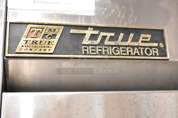 True T-35 stainless steel commercial 2-door cooler with poly-coated racks, casters, 115V, 1 phase. True Refrigerator label shown.