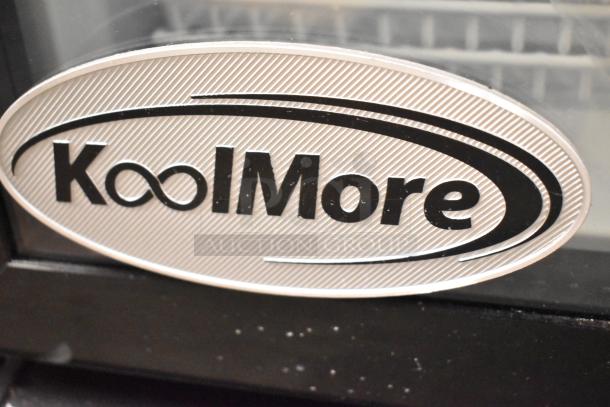 KoolMore KM-MDR-1GD-10C badge on a metal commercial single-door reach-in cooler.