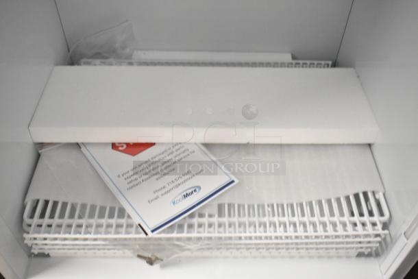 KoolMore KM-MDR-1GD-10C commercial cooler interior showing poly coated racks and customer support contact card.