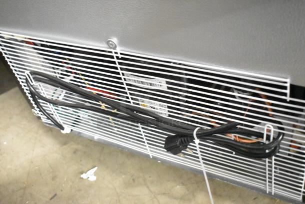 KoolMore KM-MDR-1GD-10C cooler back view with wiring and labels visible. Metal frame, commercial casters included.