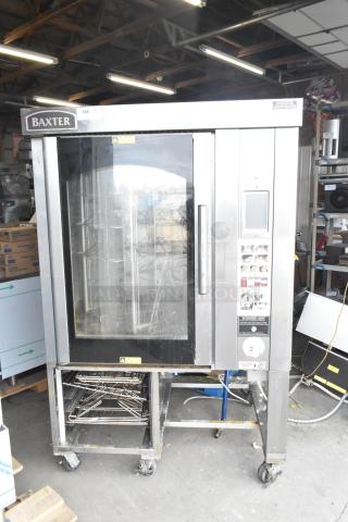 Baxter BV400G stainless steel gas-powered mini rotating rack oven on casters, with visible control panel and Baxter branding.