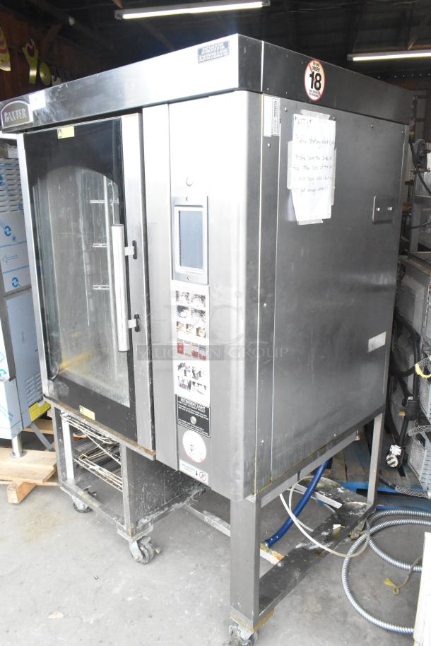 Baxter BV400G stainless steel commercial gas-powered mini rotating rack oven, on casters, display and control panel visible.