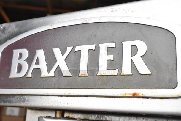 Baxter BV400G stainless steel commercial rotating rack oven, visible logo, on casters, some rust spots, gas powered.