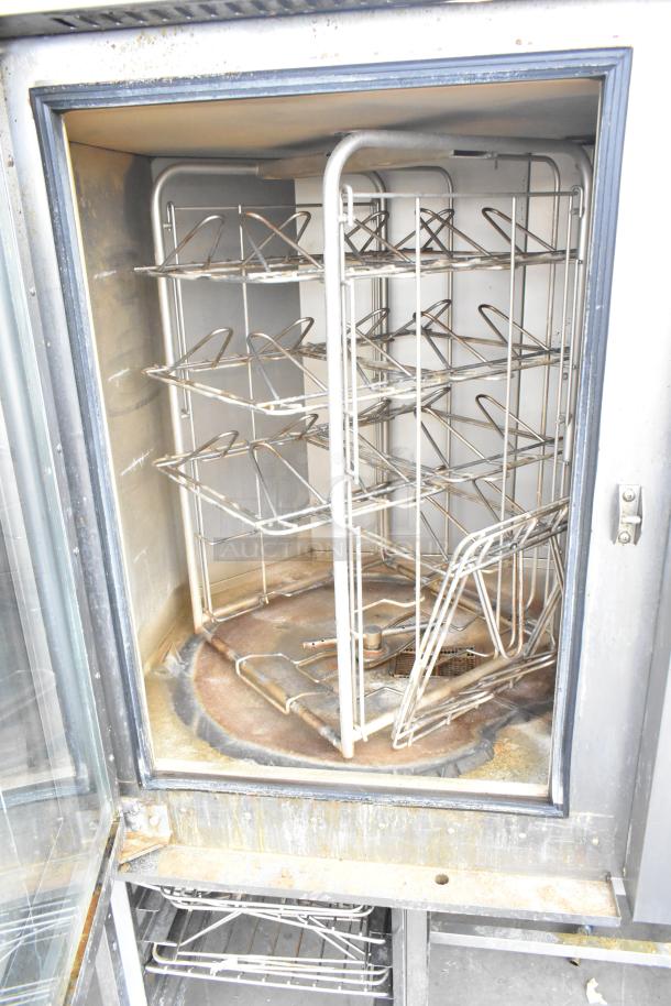 Baxter BV400G stainless steel commercial gas mini rotating rack oven, worn condition, on commercial casters.