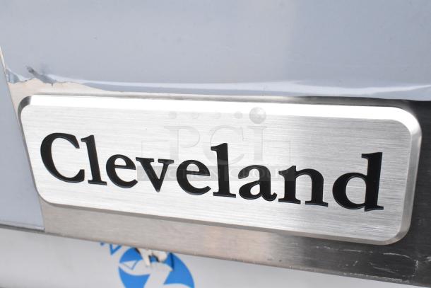 Cleveland 24CGA10 steam cabinet logo on stainless steel, slight scratch visible.