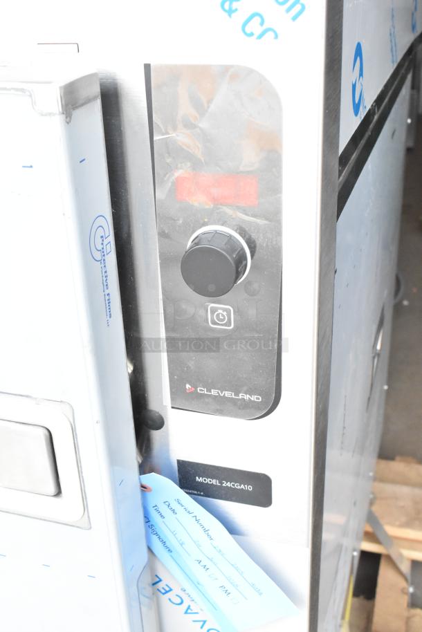 Cleveland 24CGA10 steam cabinet, stainless steel, dual deck, natural gas, 125,000 BTU, brand new, minor scratches, model tag visible.