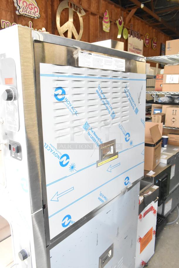 Brand new Cleveland 24CGA10 stainless steel 2-deck steam cabinet, natural gas, 125,000 BTU, minor scratches visible.