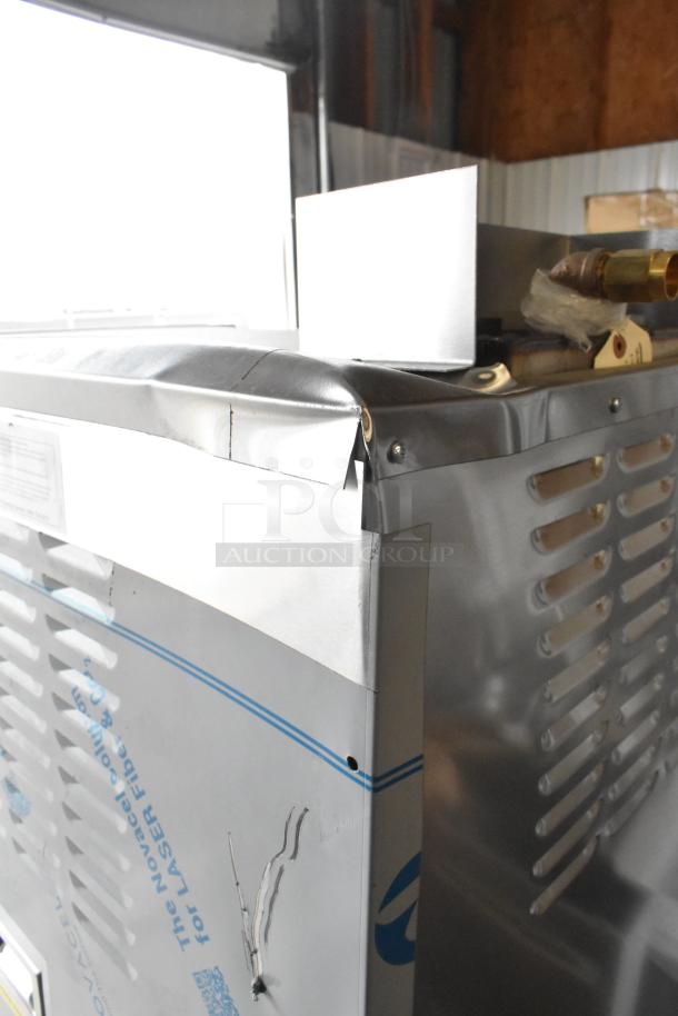 BRAND NEW Cleveland 24CGA10 stainless steel steam cabinet with dents, natural gas, 125,000 BTU, visible damage.