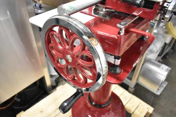 BRAND NEW Globe FS12 metal commercial meat slicer, red, flywheel manual, includes blade sharpener, pristine condition.