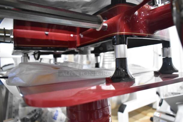 Brand new Globe FS12 metal commercial flywheel meat slicer, featuring a manual artisan design with built-in blade sharpener.