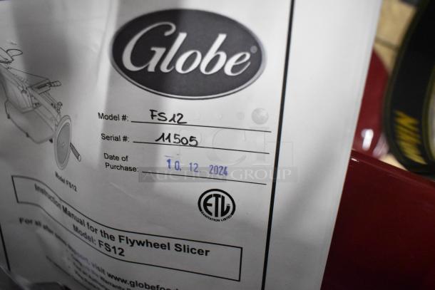 BRAND NEW Globe FS12 Metal Flywheel Artisan Meat Slicer with blade sharpener. Model FS12, serial 11505. ETL sanitation listed.